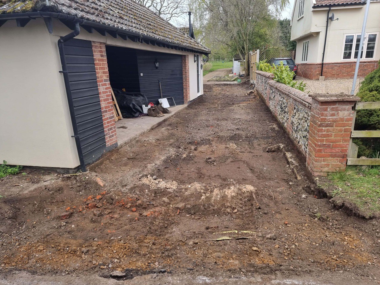 This is a tarmac driveway that is in the process of being dug out and installed by Saffron Walden Driveways
